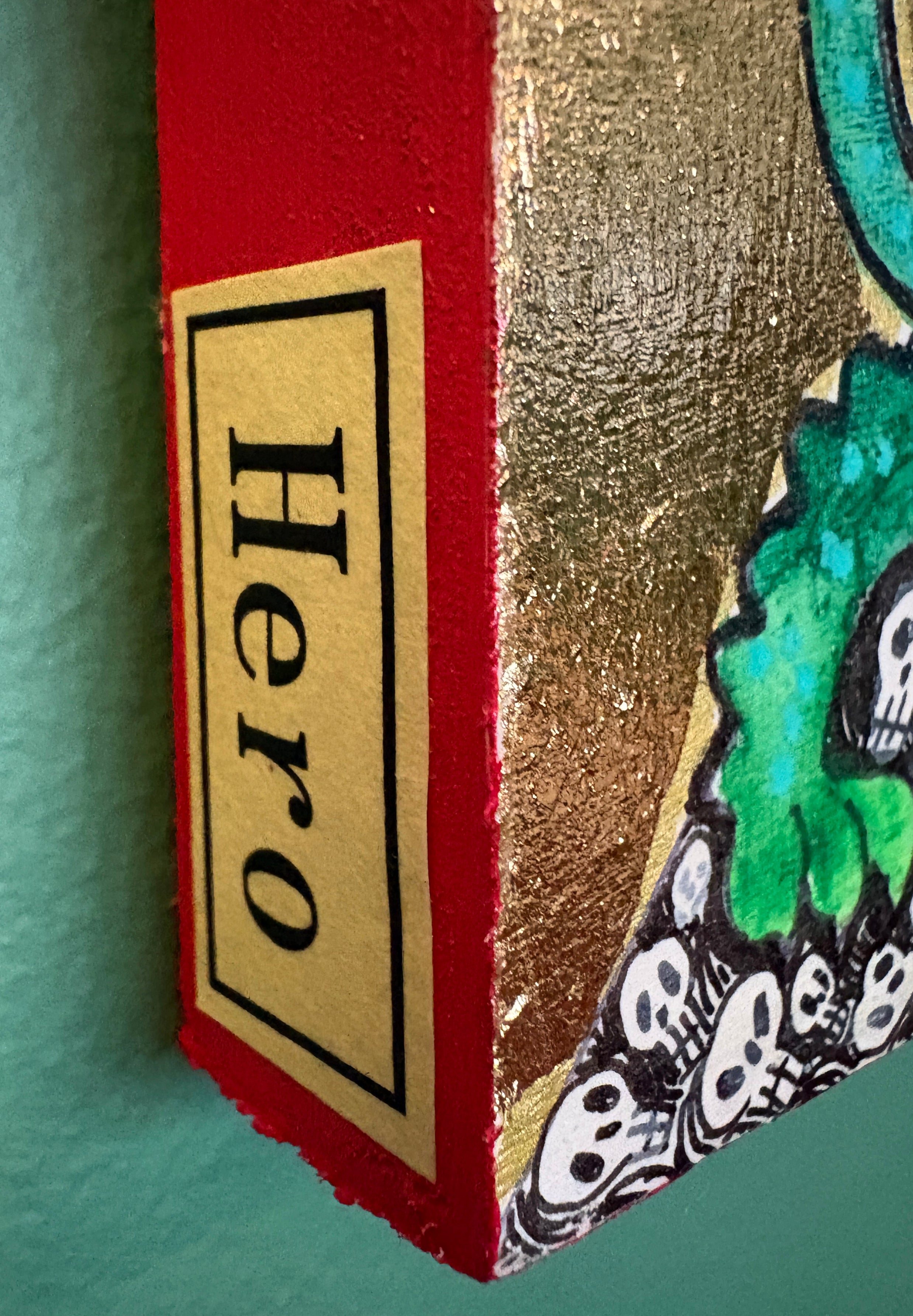"Hero" mixed media collage with gold leaf
